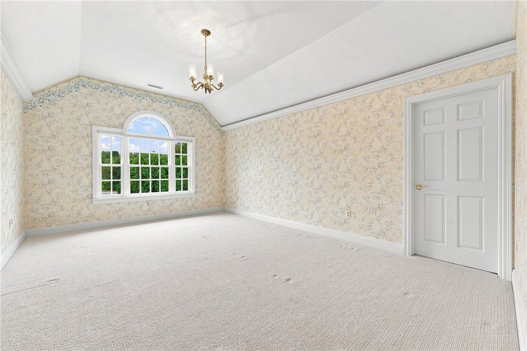Already large, the vaulted ceiling in this room give the feel of even more space.