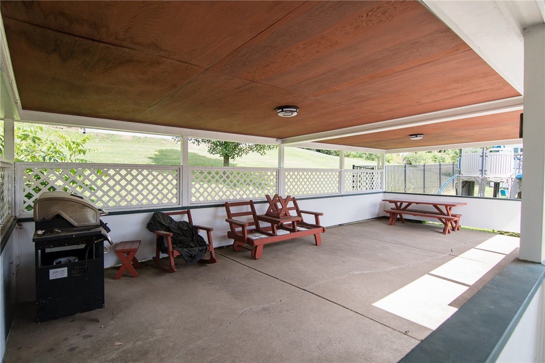 This huge covered area out back is a perfect spot for large outdoor gatherings!