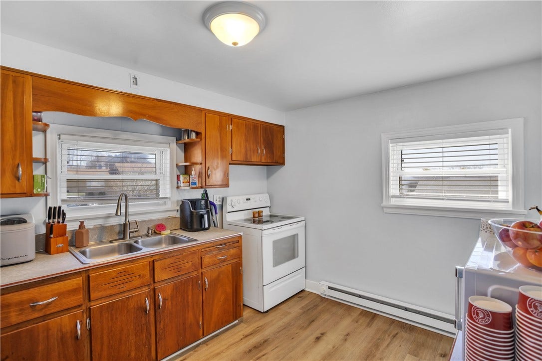 Spacious kitchen, double sink. Electric Stove and Refrigerator included
