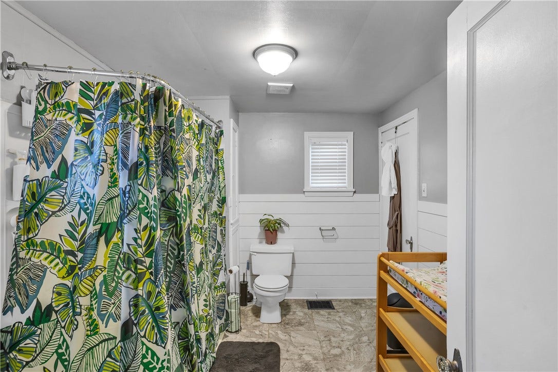 Door in bathroom leads up to 2nd floor loft bedroom