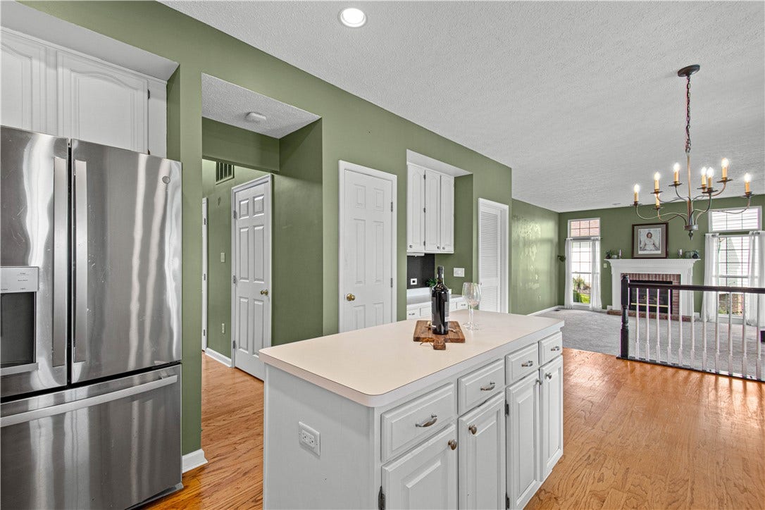 view from kitchen to pantry, mud room  and family room