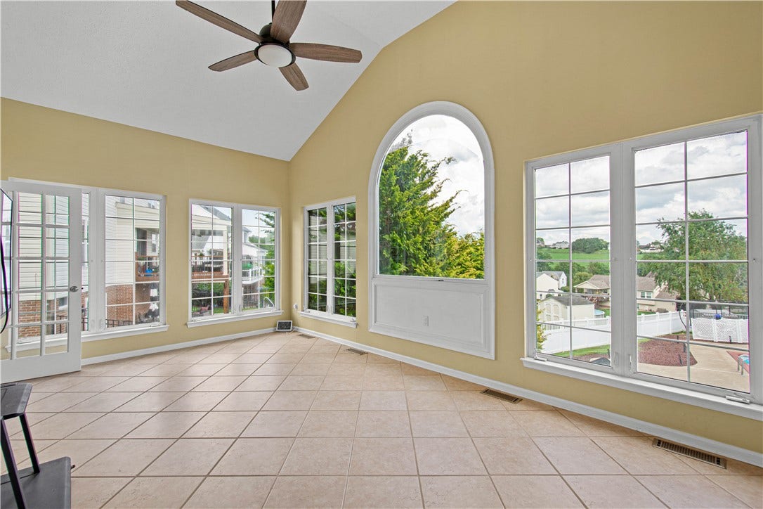 sun room with fabulous view to backyard oasis