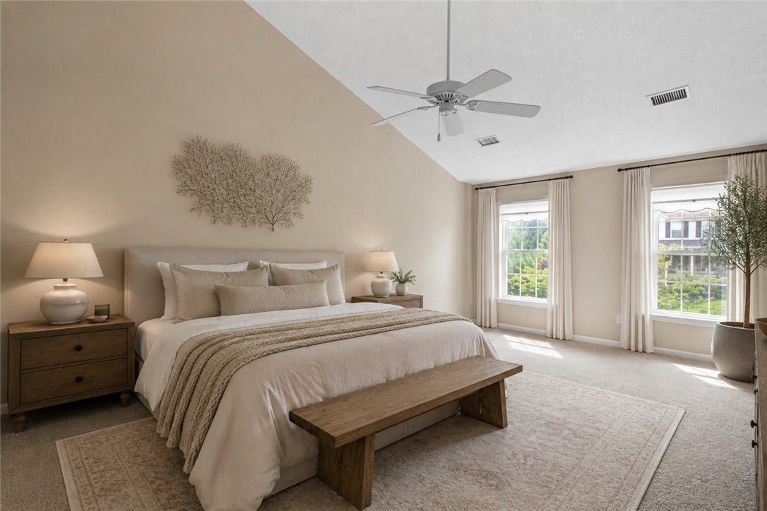 primary bedroom with vaulted ceiling virtually staged