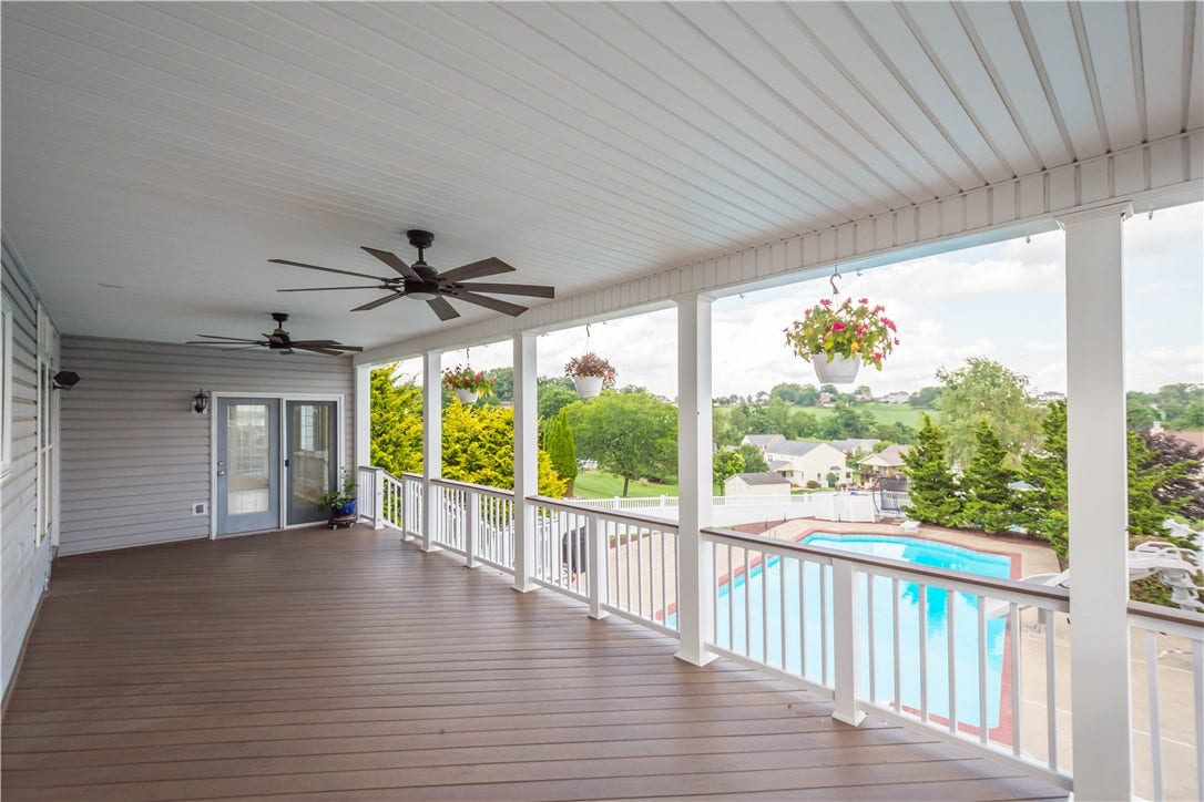 covered deck over looking enclosed back yard