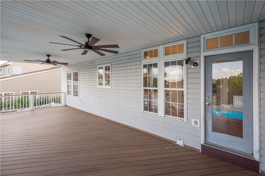 covered deck with kitchen entrance