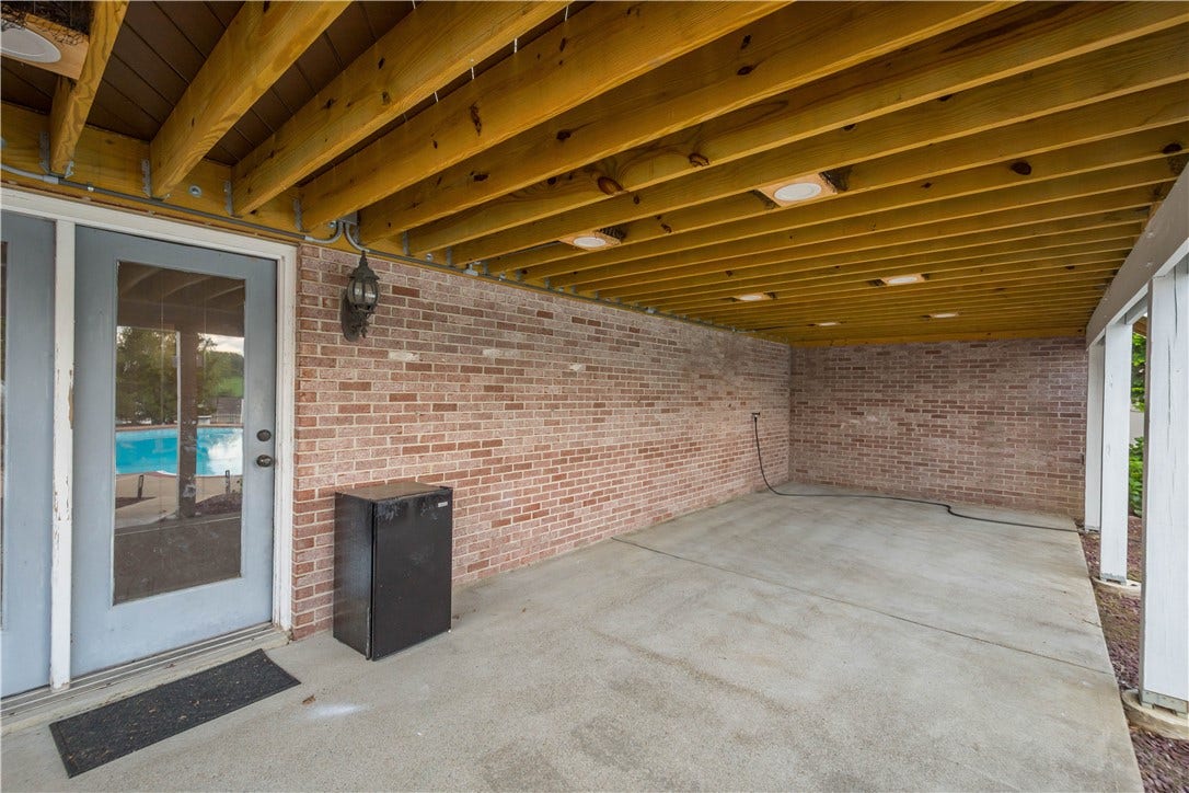 Walk out from basement to covered patio. Great space for a hot tub!