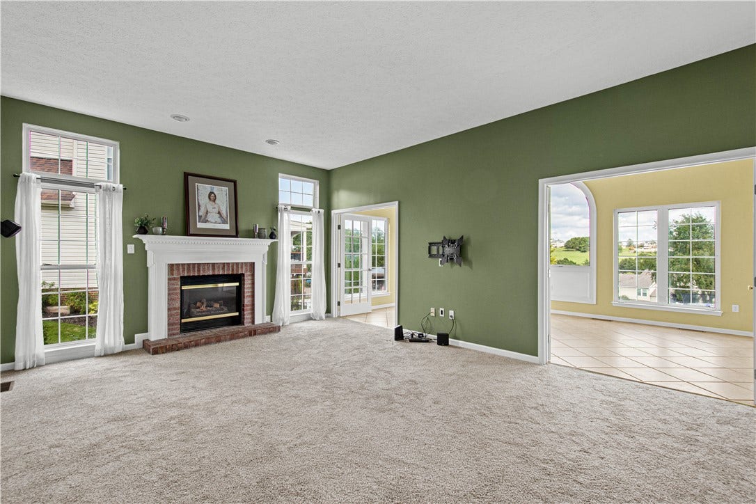 family room with French doors to sun room.