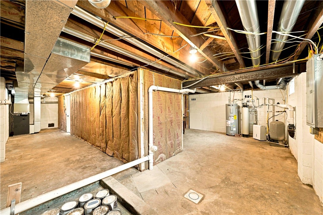 TONS OF ROOM FOR STORAGE AND/OR WORKSHOP AREA