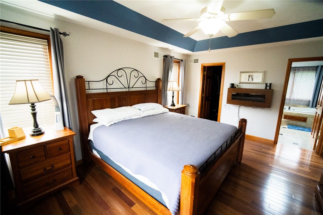 another view of the spacious primary bedroom