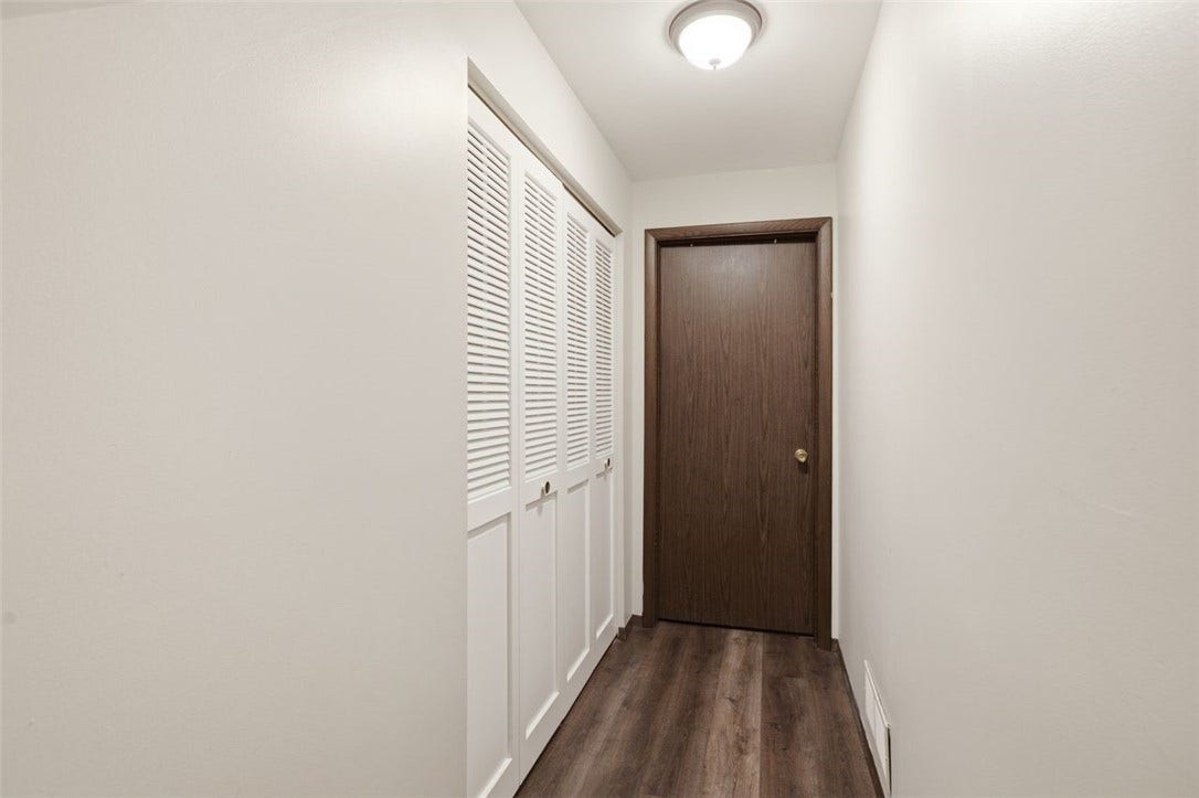 Lower level entry leads to storage, laundry, and garage