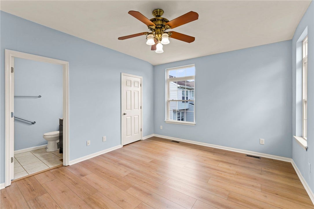 Main level bedroom suite ideal for in~law or guest space