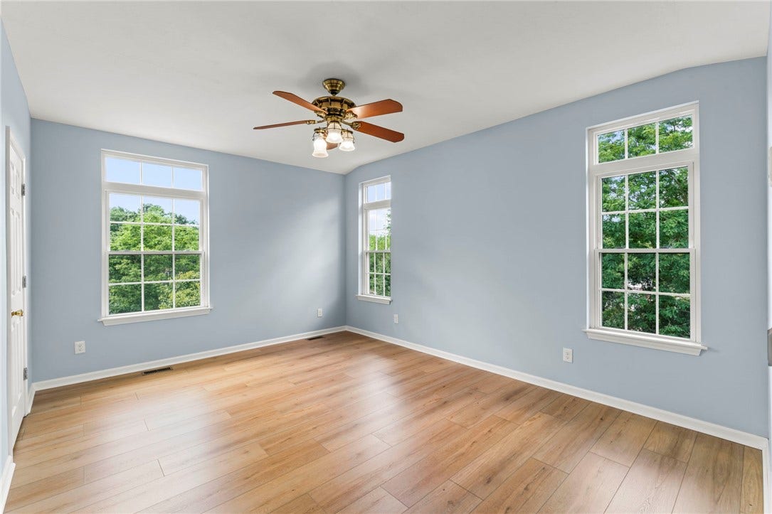 Main level bedroom suite ideal for in~law or guest space