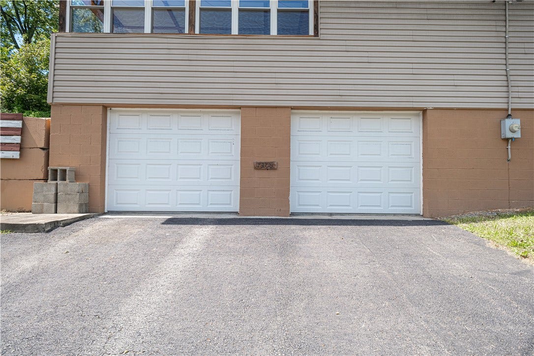 There's a large 2 car addition to the original house. These garages are oversized and would be ideal for classic cars, working on cars, running a home-based business, or for huge amounts of storage.  There's a gas heater on the wall but it hasn't been used for years, so may not work.