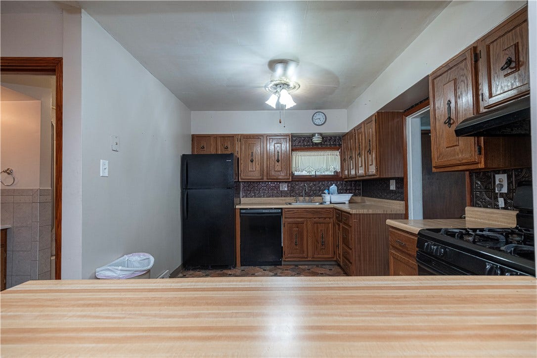 A view of the kitchen from the dining room.