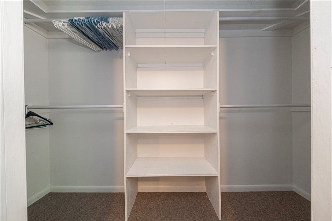 The first floor bedroom has a small walk-in-closet.
