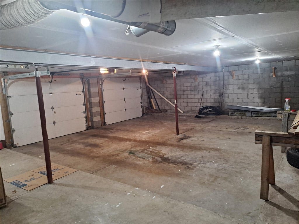The oversized 2-car garage with finished ceiling.