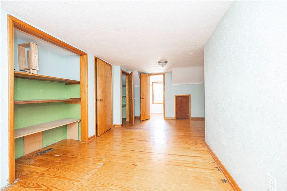 Another second floor bedroom.  Also hardwoods closets, and a window.