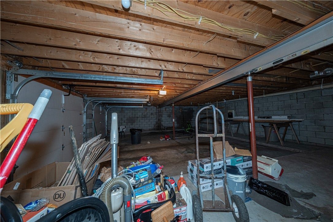 The 2-car garage is huge and has a gas heater on the wall.  It has not been operated for years, an inspection will reveal whether or not it works.