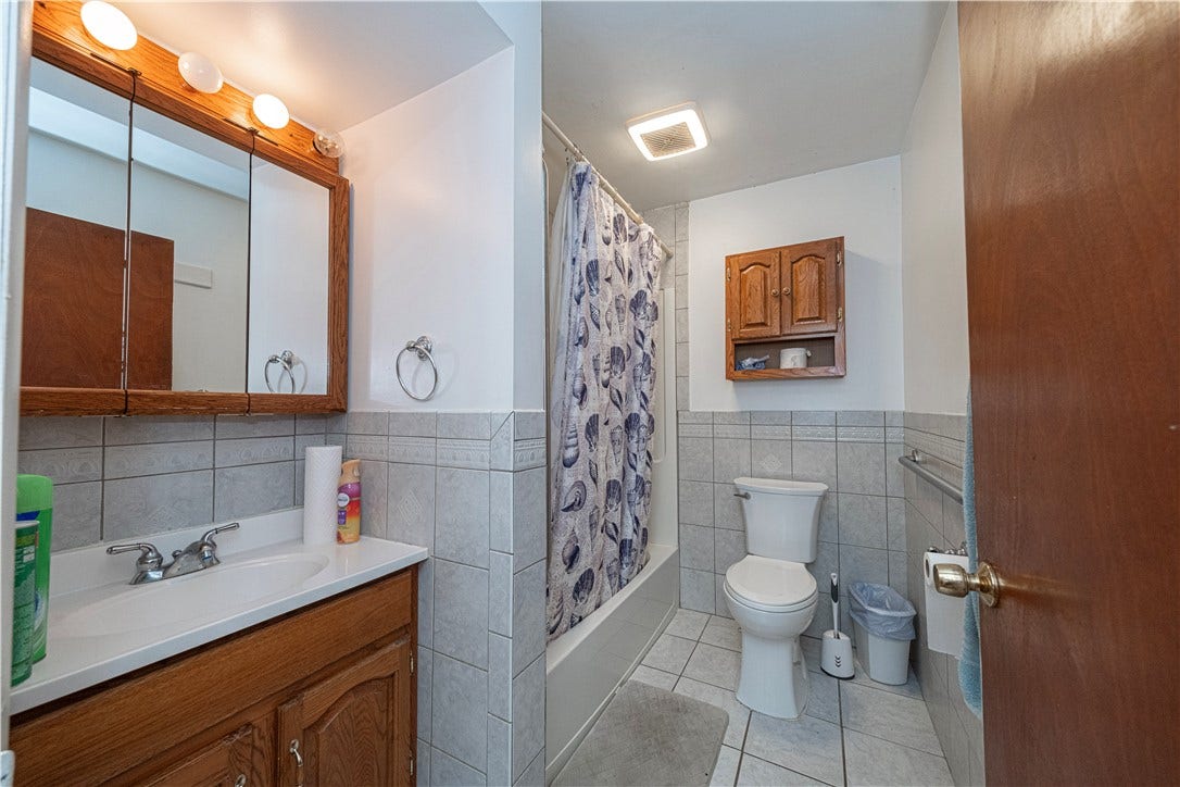 This is the tastefully updated main hall bath on the first floor.