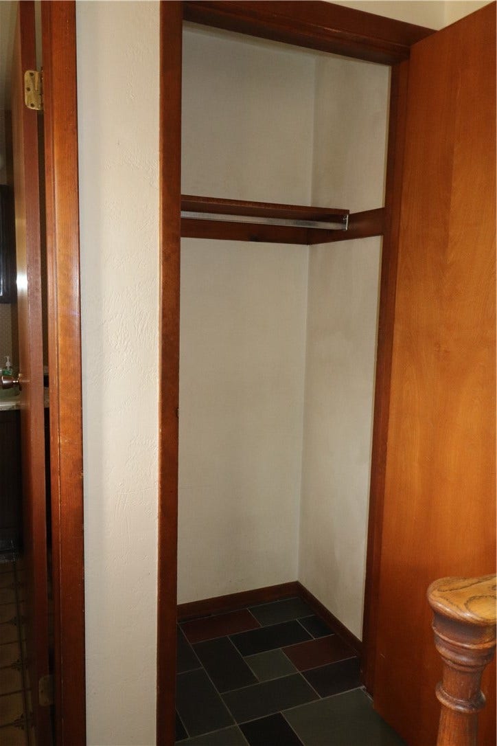Coat closet next to the half bath.