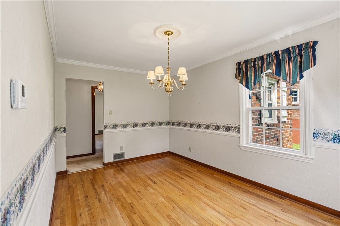 Crown molding and chair rail with hardwood exposed.