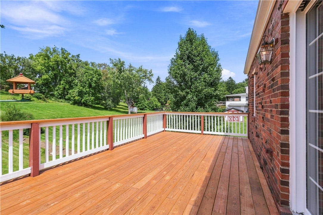 The sunny deck overlooks the vast back yard.