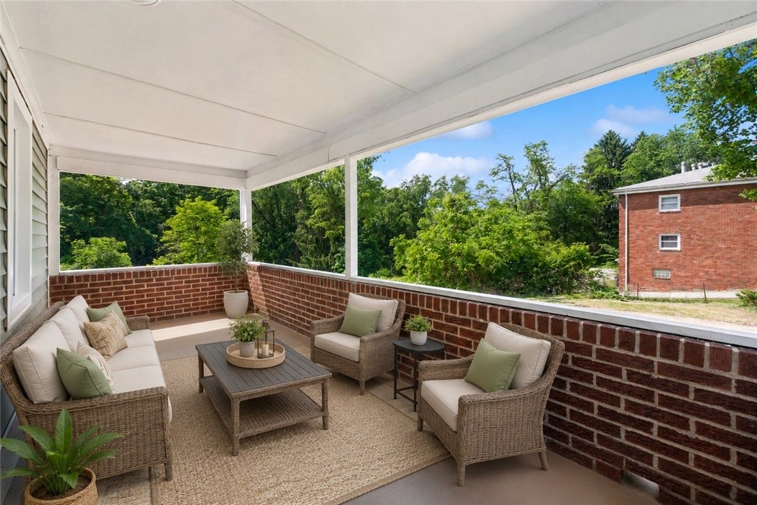 Large covered patio *virtually staged*