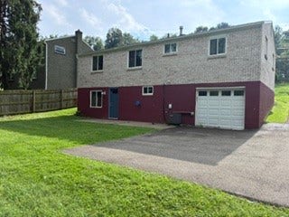 1120 O Block Road, Pittsburgh, PA 15239 Back of home with patio and long driveway.