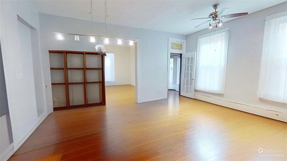 5546 Hays St, Pittsburgh, PA 15206 Wide view of the dining room / great room space that also opens to the 3 season sunroom