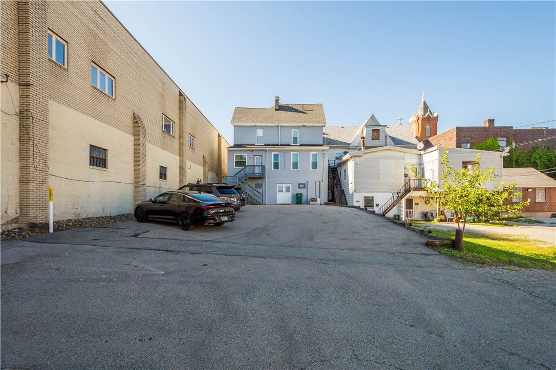 9 parking spaces accesible from alley behind the building