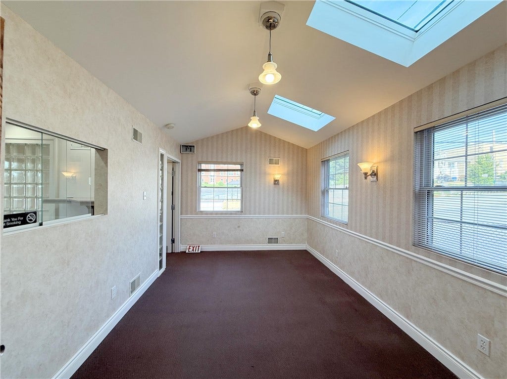 Waiting Room with window into Receptionist Area