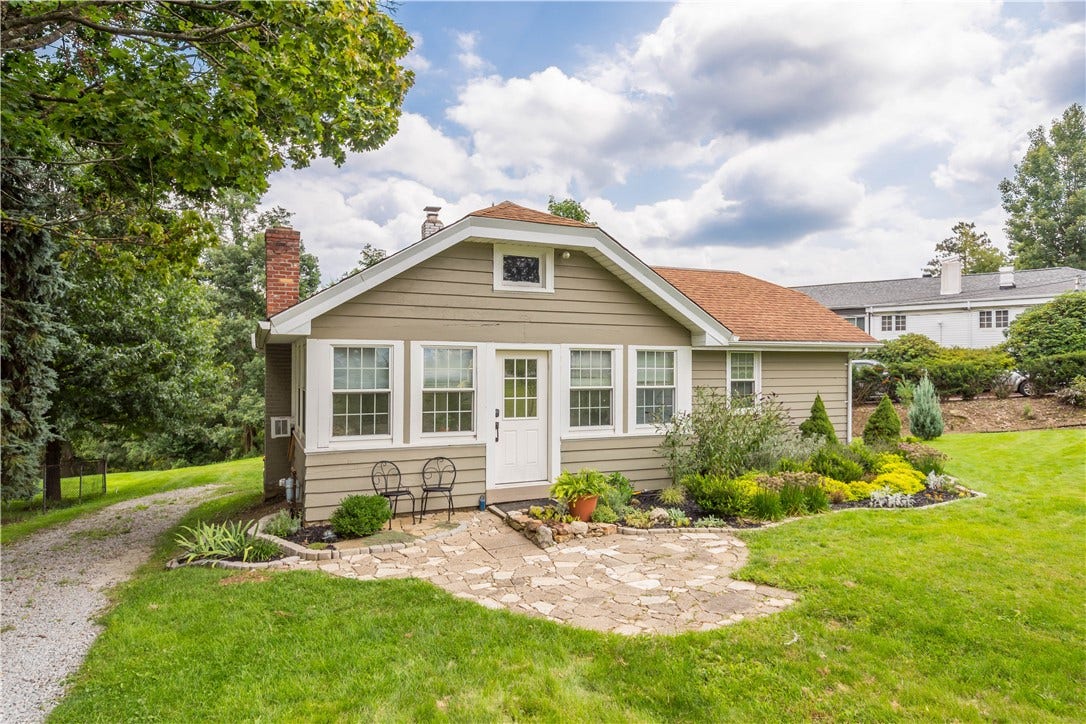 Unpaved driveways on left and right of the house for plenty of off street parking