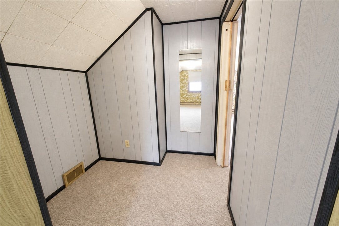 Hallway from the extra room into the bedroom of the upper floor with an extra space!