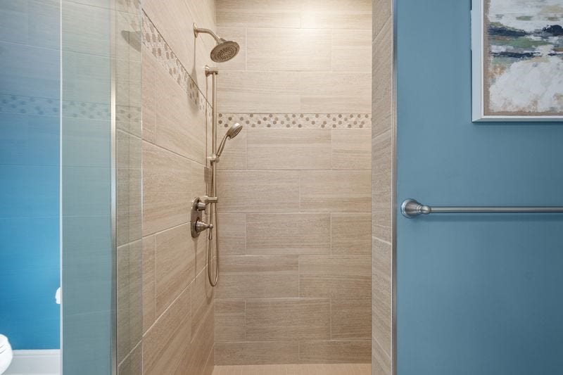 Spacious ceramic shower.