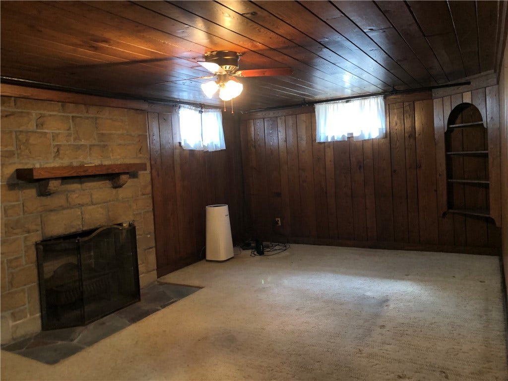 Family room has built in bookcase and closet