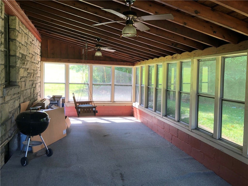 Covered screened in back porch is 27x12!