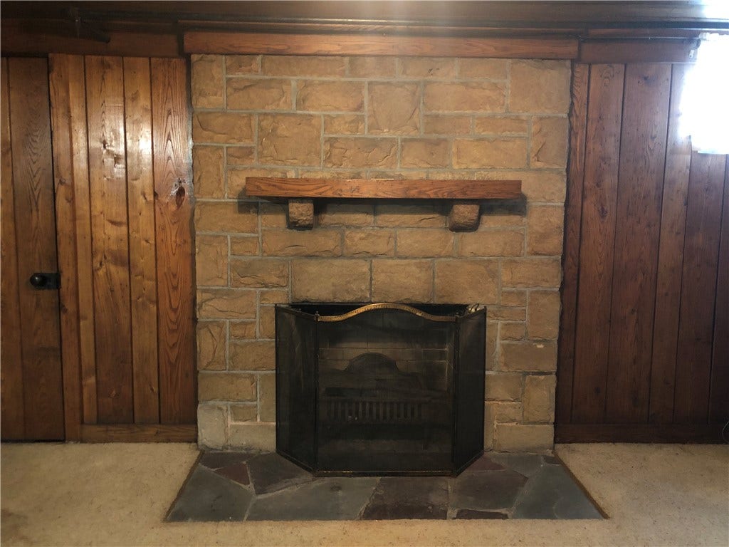 Family room has wood burning fireplace!