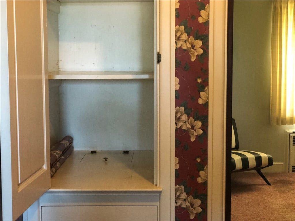 This main level cupboard also has a laundry chute!