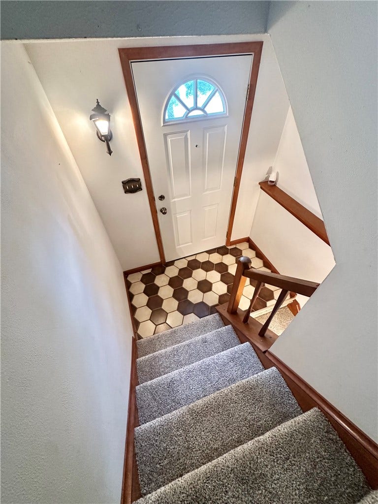 front door and steps up to main level