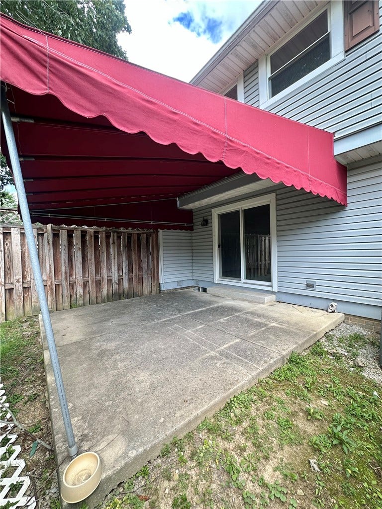 coved back patio with awning