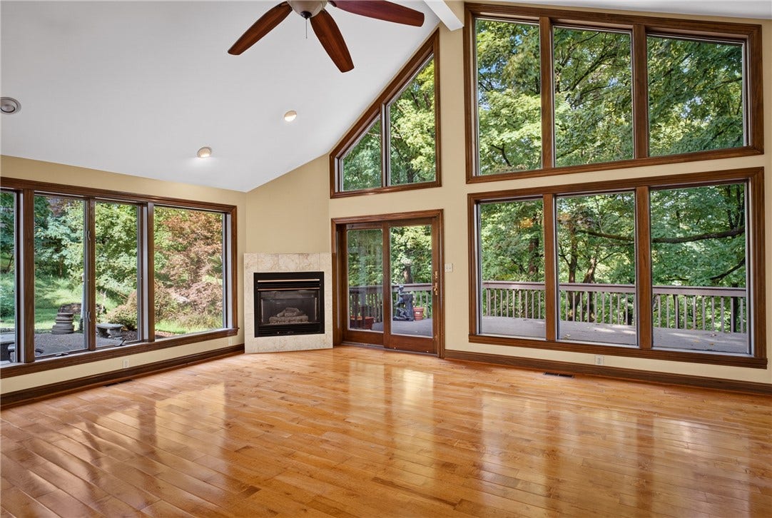 Vaulted ceilings and wood floors enhance the spacious family room.