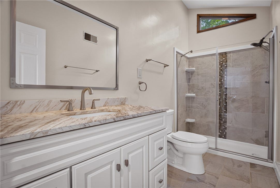 Newly renovated hall bath with stylish modern finishes.