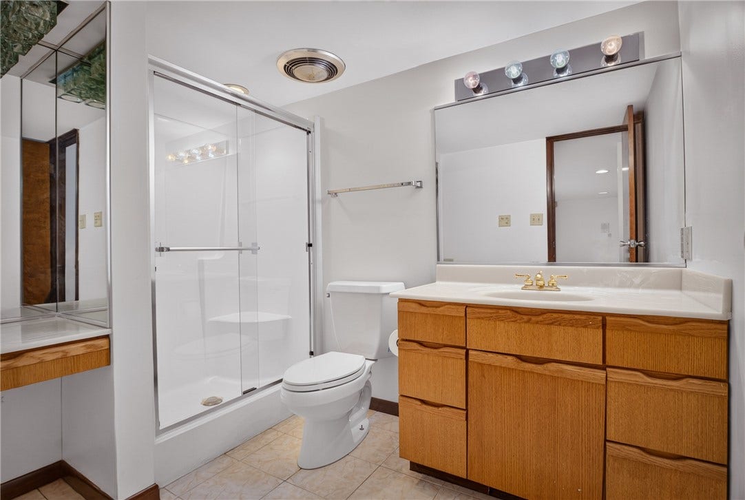 The versatile lower-level den includes its own full bath.