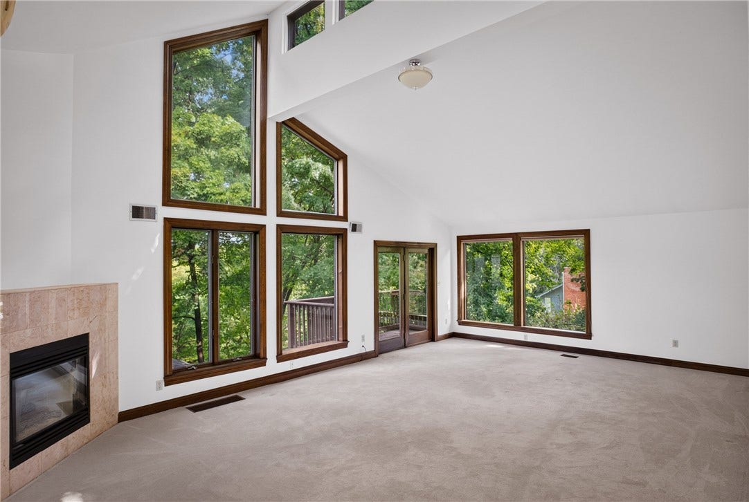The spacious primary suite is a peaceful private retreat.