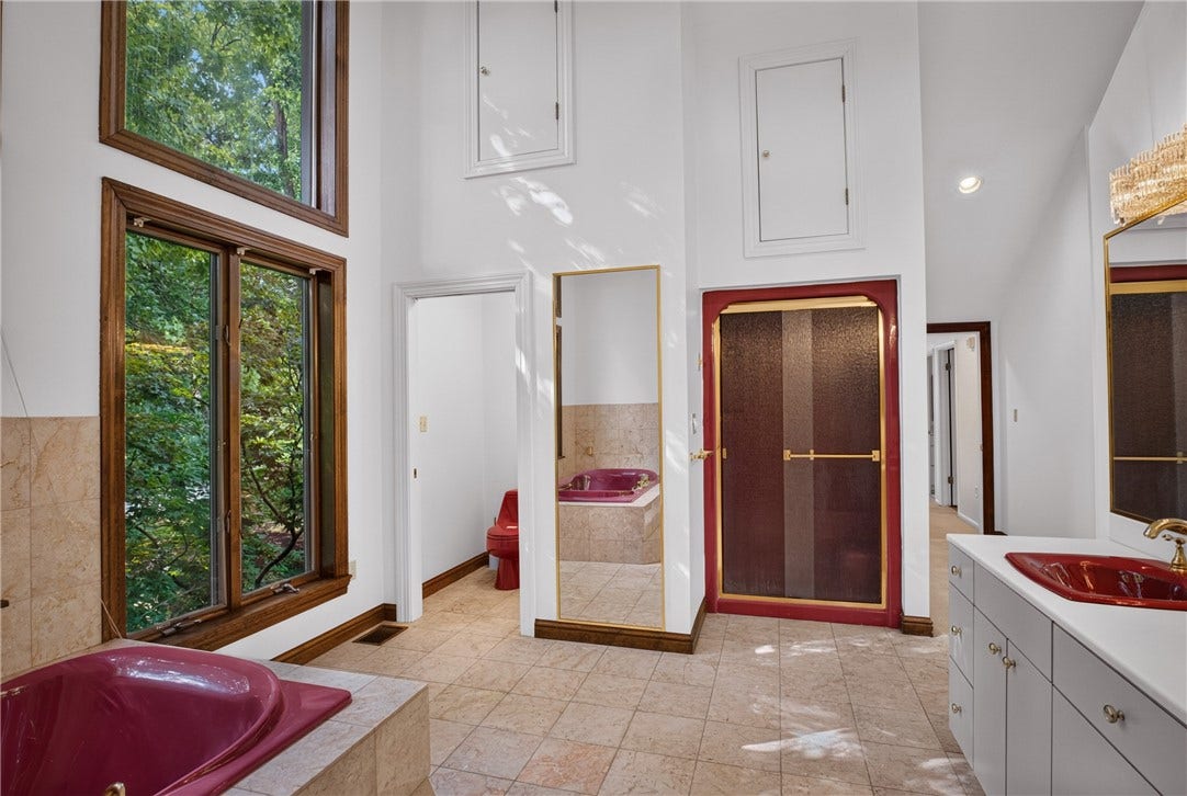 A serene primary suite with beautiful views and abundant natural light.
