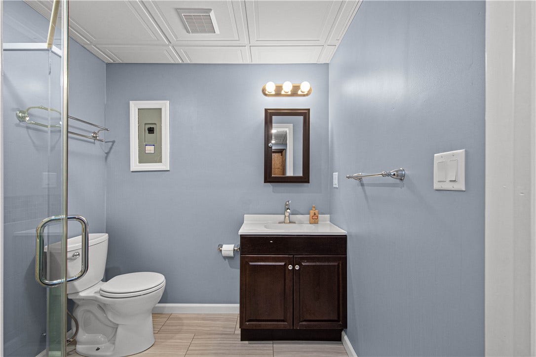 An updated full bath adds flexibility to the finished lower level.