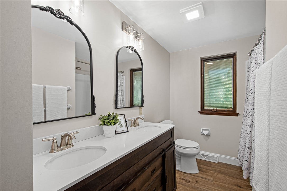 A fresh, updated secondary bath serves additional bedrooms.