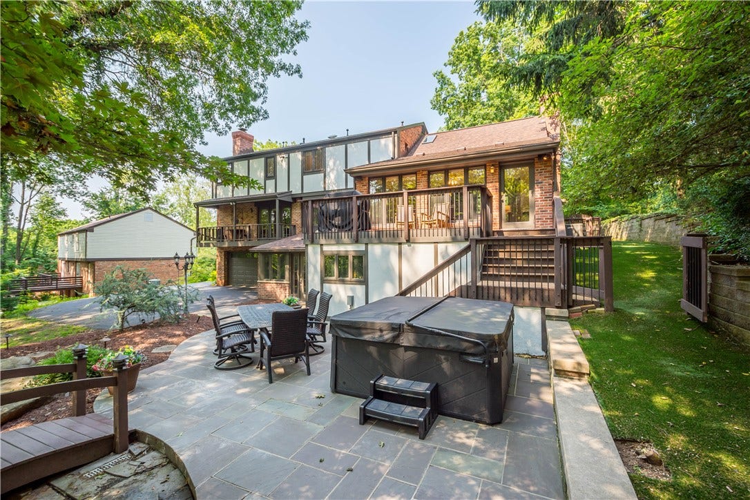 Generous patio and gathering spaces create an effortless setting for summer dinners, weekend entertaining, and evenings outdoors.