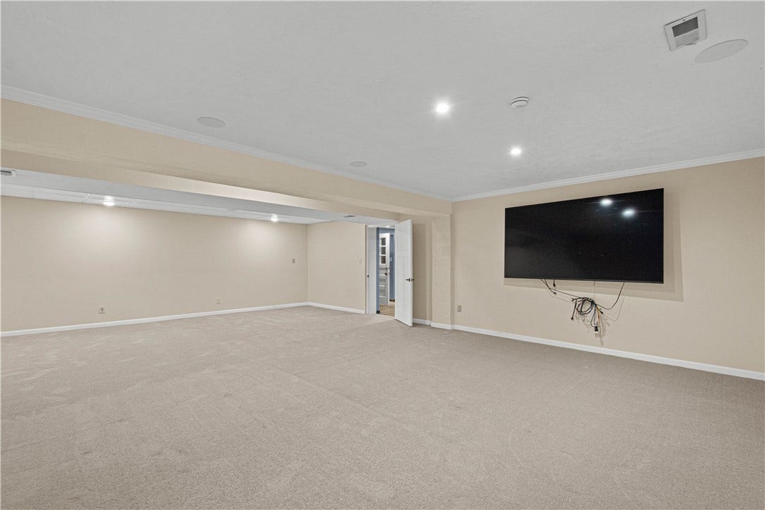 Finished basement space offers endless possibilities for movie nights, recreation, fitness, or entertaining.