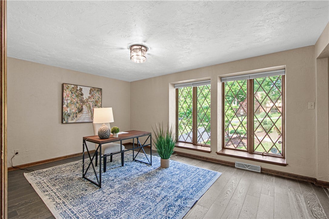 A dedicated main-level office offers a quiet, comfortable setting for working from home.